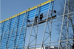 Our works are installing blue color windbreak wall with yellow top